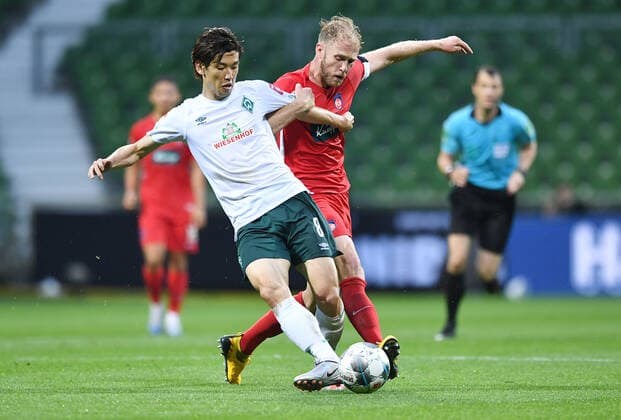 Werder Bremen 1 FC Heidenheim Football, Relegation, Werder Bremen 1 FC Heidenheim v l Yuya Osako Bremen , Sebastian Griesbeck Photo Tim Groothuis Witters Pool via xim gs DFL regulations prohibit any use of photographs as image sequences and or quasi video Editorial use only National and international news agencies out Bremen Germany Poolfoto Tim Groothuis Witters Pool via xim.gs ,EDITORIAL USE ONLY