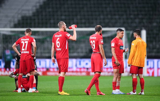 Werder Bremen 1 FC Heidenheim Football, Relegation, Werder Bremen 1 FC Heidenheim After the game Konstantin Kerschbaumer Heidenheim , Patrick Mainka Heidenheim , Jonas Foehrenbach Heidenheim leave the pitch Photo Marvin Ibo Güngör GES Pool via xim gs DFL regulations prohibit any use of photographs as image sequences and or quasi video Editorial use only National and international news agencies out Bremen Germany Poolfoto Marvin Ibo Güngör GES Pool via xim.gs ,EDITORIAL USE ONLY