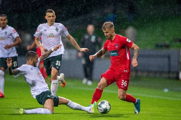 GER, Werder Bremen vs. FC Heidenheim, Football, Bundesliga Religation, 2019 2020, 02 07 2020 Leonardo Bittencourt SV Werder Bremen 10 , Niklas Dorsch FC Heidenheim, 36 , GER, Werder Bremen vs. FC Heidenheim, Football, Bundesliga Religation, 2019 2020, 02 07 2020, DFB DFL regulations prohibit any use of photographs as image sequences and or quasi video , Foto EIBNER Sascha Walther Bremen Weser Stadium Hanseatic City of Bremen Germany Poolfoto Eibner Walther Pool ,EDITORIAL USE ONLY