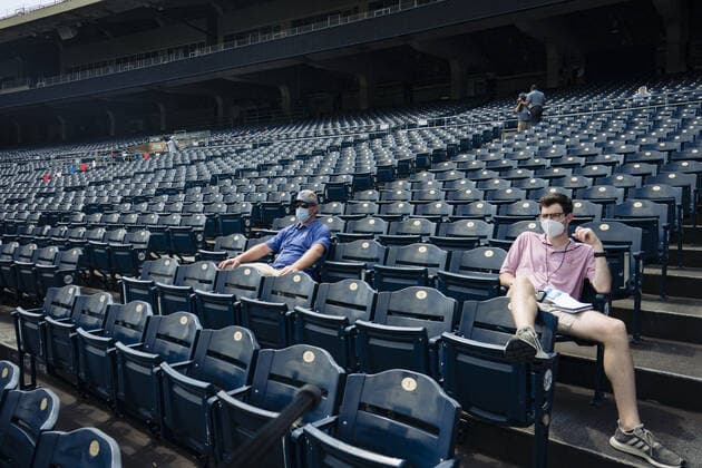 Media and Kansas City Royals staff watch the Royals practice at the start of Summer Camp training at Kaufman Stadium in Kansas City, Missouri on Friday, July 3, 2020. Major League Baseball is finally starting their 2020 season after the COVID-19 pandemic caused months of delays.  KCP20200703129 KYLExRIVAS
