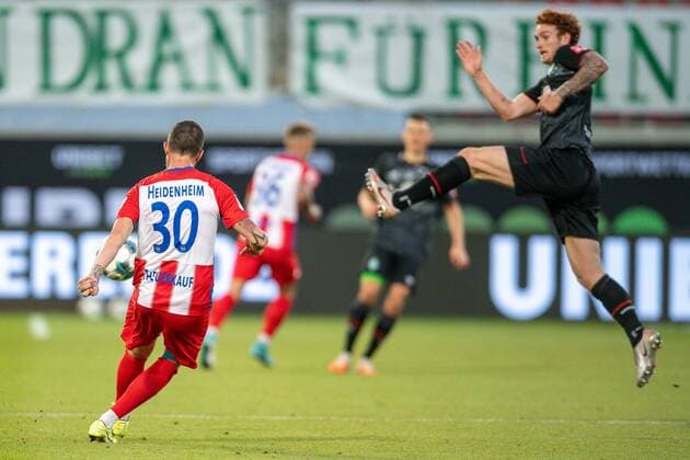 GER, FC Heidenheim vs Werder Bremen, Football, Bundesliga Religation, 2019 2020, 06 07 2020 Norman Theuerkauf FC Heidenheim, 30 , Joshua Sargent SV Werder Bremen 19 , GER, FC Heidenheim vs Werder Bremen, Football, Bundesliga Religation, 2019 2020, 06 07 2020, DFB DFL regulations prohibit any use of photographs as image sequences and or quasi video , Foto EIBNER Sascha Walther Heidenheim Voith Arena Baden Wuerttemberg Germany Poolfoto Eibner Walther Pool ,EDITORIAL USE ONLY