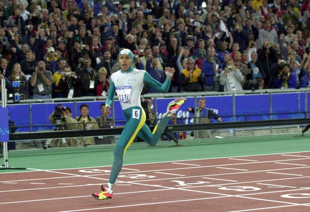 OLYMPICS ATHLETICS 400M FINAL, (RUN217) 25th September, 2000. Sydney Olympic Games, Olympische Spiele, Olympia, OS Athletics at Stadium Australia. Womens 400m Final. Australia s Cathy Freeman crosses the finish line taking Gold in the Womens 400m Finals. (AAP PHOTO Dean Lewins). NO ARCHIVING, EDITORIAL USE ONLY, NO USE IN BOOKS WITHOUT CONSENT SYDNEY AUS  Copyright: xDEANxLEWINSx 0102234358st