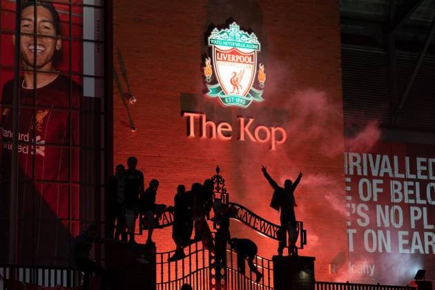 Football - 2019 2020 Premier League - Liverpool vs Chelsea Fans celebrate outside the stadium, at Anfield 