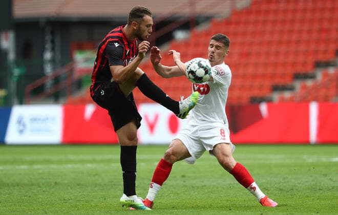 Nice s Amine Gouiri and Standard s Gojko Cimirot fight for the ball during a friendly soccer game between Standard de Liege and OGC Nice, Saturday 25 July 2020 in Liege, in preparation of the upcoming 2020-2021 Jupiler Pro League season. VIRGINIExLEFOUR  x2521869x