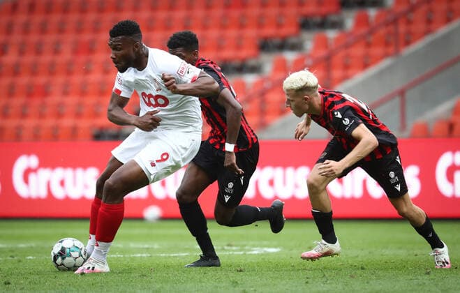 Standard s Obbi Oulare and Nice s Alexis Trouillet fight for the ball during a friendly soccer game between Standard de Liege and OGC Nice, Saturday 25 July 2020 in Liege, in preparation of the upcoming 2020-2021 Jupiler Pro League season. VIRGINIExLEFOUR  x2521883x