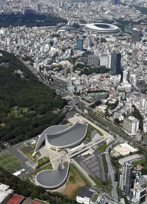 Tokyo s new National Stadium, Yoyogi National Stadium Photo taken Aug. 4, 2020, from a Kyodo News helicopter shows Tokyo s new National Stadium (top) and Yoyogi National Stadium (bottom) -- among the venues of the Olympics and Paralympics, postponed to 2021 due to the coronavirus pandemic. 