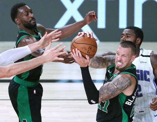 August 9, 2020, Orlando, FL, USA: Boston Celtics forward Daniel Theis (27) aggresively pulls in a rebound in front of Orlando Magic forward Gary Clark (right) and Boston Celtics guard Jaylen Brown (left) on Sunday, August 9, 2020 at Disney s ESPN Wide World of Sports in Orlando, Florida. Orlando USA - ZUMAm67_ 20200809_zaf_m67_041 Copyright: xStephenxM.xDowellx