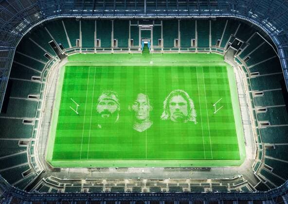 The pitch at Twickenham Stadium has been transformed into a stunning portrait featuring three of Premiership Rugby?s star players today (12th August 2020). The giant rugby art, the largest outdoor painting ever created in the UK, was unveiled to celebrate the restart of Gallagher Premiership Rugby on Friday 14 th August when Harlequins take on Sale Sharks at 7:45pm, just 200 metres away. The artwork features Harlequins player, Joe Marler; Saracens? Maro Itoje, as well as Sale Sharks? Rugby World Cup winner Faf de Klerk. It took team of eight artists more than 24 hours to complete the pitch portrait and more than 100 hours of planning before any paint touched the grass. A bespoke computer program was written to generate the precise measurements that were needed to create the artwork to the exact scale of the stadium. The image, which occupies most of the 7,000 square metre pitch, was created using a grid comprised of 13,420 elements. Each painted line in the portrait is just 6 inches wide. Nearly 1280 litres of biodegradable pitch marker paint were used for the elaborate creation. An estimated 150,000 passengers will enjoy the spectacle from the sky this week on flights in and out of London?s Heathrow airport. Faf de Klerk was one of the featured Premiership Rugby stars in the portrait. The Sale Sharks star said, I didn t realise it was going to be on the field, I thought it was going to be a photo up somewhere or on the big screen. It s looking really cool. There are a lot of great players in the Premiership, and it is amazing. I feel really privileged and quite humble . Speaking about the impact of lockdown on the Saracens star Maro Itoje said The last few months have been really tough on fans and players but we?re back and we?re ready for the start of the season on Friday 14th August. The past five months has shown us how important the sport is and what it brings to people lives. British artist John Lundberg, who oversaw the po Copyright: xScottxGarfitt PinPep CoverxImagesx 0103040115st EDITORIAL USE ONLY. RESTRICTED TO NEWSPAPERS BASED IN THE UK