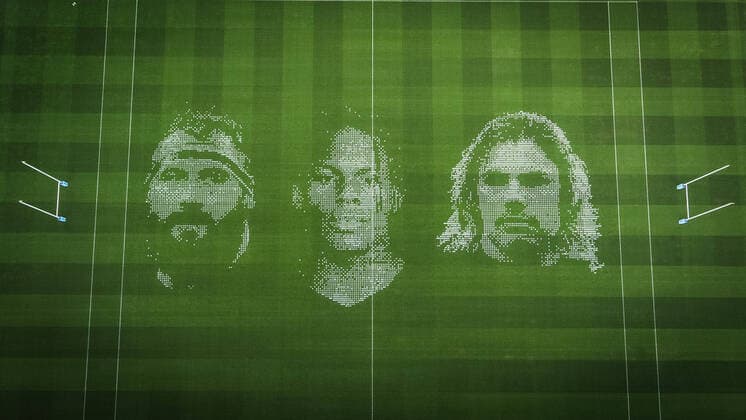 The pitch at Twickenham Stadium has been transformed into a stunning portrait featuring three of Premiership Rugby?s star players today (12th August 2020). The giant rugby art, the largest outdoor painting ever created in the UK, was unveiled to celebrate the restart of Gallagher Premiership Rugby on Friday 14 th August when Harlequins take on Sale Sharks at 7:45pm, just 200 metres away. The artwork features Harlequins player, Joe Marler; Saracens? Maro Itoje, as well as Sale Sharks? Rugby World Cup winner Faf de Klerk. It took team of eight artists more than 24 hours to complete the pitch portrait and more than 100 hours of planning before any paint touched the grass. A bespoke computer program was written to generate the precise measurements that were needed to create the artwork to the exact scale of the stadium. The image, which occupies most of the 7,000 square metre pitch, was created using a grid comprised of 13,420 elements. Each painted line in the portrait is just 6 inches wide. Nearly 1280 litres of biodegradable pitch marker paint were used for the elaborate creation. An estimated 150,000 passengers will enjoy the spectacle from the sky this week on flights in and out of London?s Heathrow airport. Faf de Klerk was one of the featured Premiership Rugby stars in the portrait. The Sale Sharks star said, I didn t realise it was going to be on the field, I thought it was going to be a photo up somewhere or on the big screen. It s looking really cool. There are a lot of great players in the Premiership, and it is amazing. I feel really privileged and quite humble . Speaking about the impact of lockdown on the Saracens star Maro Itoje said The last few months have been really tough on fans and players but we?re back and we?re ready for the start of the season on Friday 14th August. The past five months has shown us how important the sport is and what it brings to people lives. British artist John Lundberg, who oversaw the po Copyright: xScottxGarfitt PinPep CoverxImagesx 0103040120st EDITORIAL USE ONLY. RESTRICTED TO NEWSPAPERS BASED IN THE UK