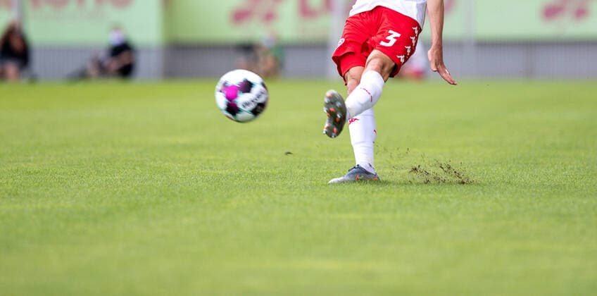 Germany Rheinland Pfalz Mainz 15 08 2020 Football Friendly Matches Men Season 2020 2021 FSV Mainz 05 red FC Würzburger Kickers yellow v l symbol photo Ball is shot and grass flies with Sport FSV Mainz 05 FC Würzburger Kickers