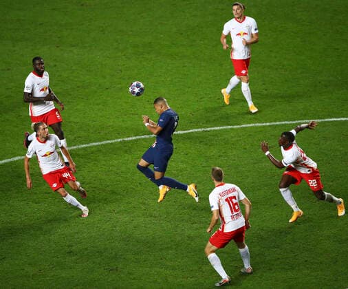(200820) -- BEIJING, Aug. 20, 2020 -- Kylian Mbappe of Paris Saint-Germain wins a header during the UEFA Champions League Semi Final match between RB Leipzig and Paris Saint-Germain F.C in Lisbon, Portugal, Aug. 18, 2020. (Photo by Julian Finney UEFA via Xinhua) XINHUA PHOTOS OF THE DAY WenxXinnian 