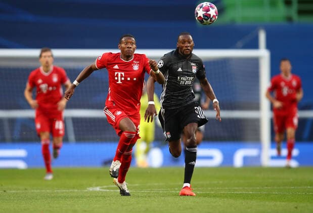 FOOTBALL Bayern Munich vs Olympique Lyonnais 1 2 Phase final UEFA Champions League Final 8 Lisbonne 19 08 2020 LISBON, PORTUGAL AUGUST 19 David Alaba of Bayern Munich battles for possession with Karl Toko Ekambi of Olympique Lyonnais during the UEFA Champions League Semi Final match between Olympique Lyonnais and Bayern Munich at Estadio Jose Alvalade on August 19, 2020 in Lisbon, Portugal Lisbonne Portugal Poolfoto Panoramic POOL UEFA ,EDITORIAL USE ONLY