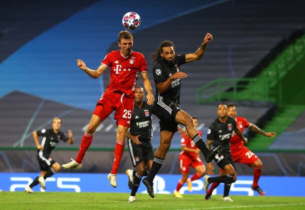 FOOTBALL Bayern Munich vs Olympique Lyonnais 1 2 Phase final UEFA Champions League Final 8 Lisbonne 19 08 2020 LISBON, PORTUGAL AUGUST 19 Thomas Mueller of Bayern Munich and Bertrand Traore of Olympique Lyonnais battle for a header during the UEFA Champions League Semi Final match between Olympique Lyonnais and Bayern Munich at Estadio Jose Alvalade on August 19, 2020 in Lisbon, Portugal Lisbonne Portugal Poolfoto Panoramic POOL UEFA ,EDITORIAL USE ONLY