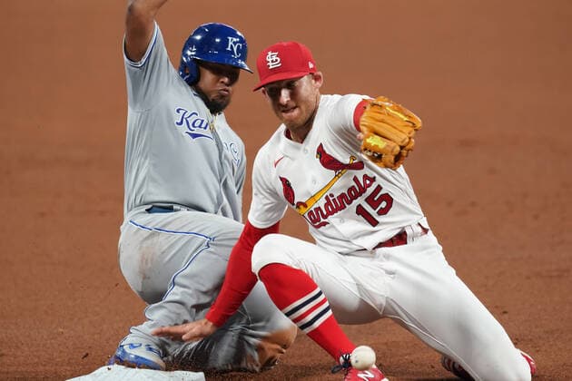 Kansas City Royals Meibrys Viloria is safe at third base while St. Louis Cardinals Brad Miller fights with catcher Yadier Molina s wide throw in the third inning at Busch Stadium in St. Louis on Monday, August 24, 2020.  SLP2020082409 BILLxGREENBLATT