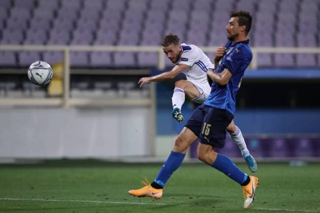 Edin Visca of Bosnia and Herzegovina shoots goalwards as Francesco Acerbi of Italy closes in during the UEFA Nations League match at Stadio Artemio Franchi, Florence. Picture date: 4th September 2020. Picture credit should read: Jonathan Moscrop Sportimage EDITORIAL USE ONLY. No use with unauthorised audio, video, data, fixture lists, club league logos or live services. Online in-match use limited to 120 images, no video emulation. No use in betting, games or single club league player publications. SPI-0644-0024