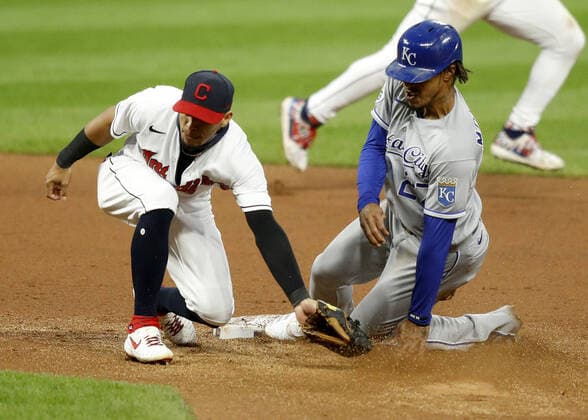 Kansas City Royals Adalberto Mondesi (27) steals second base as Cleveland Indians second baseman Cesar Hernandez (7) is late on the tag in the fifth inning against the Cleveland Indians at Progressive Field in Cleveland, Ohio on Monday, September 7, 2020.  CLE20200907117 AARONxJOSEFCZYK