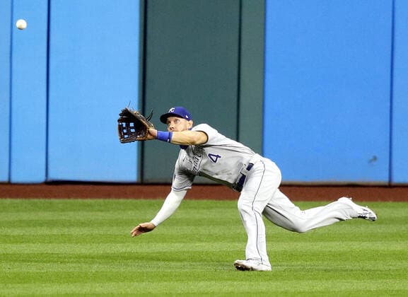 Kansas City Royals Alex Gordon (4) makes a diving catch in the fifth inning against the Cleveland Indians at Progressive Field in Cleveland, Ohio on Monday, September 7, 2020.  CLE20200907115 AARONxJOSEFCZYK