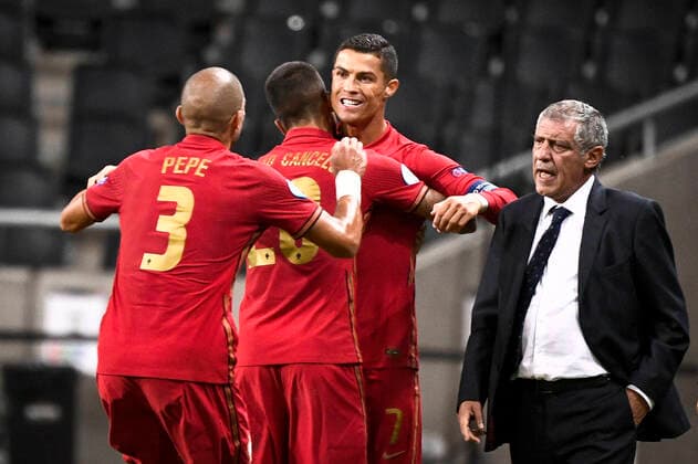 Portugal s Christiano Ronaldo is congratulated on his 100th goal by Pepe and Joao Cancelo and national team captain Fernando Santo during the UEFA Nations League, division A, group 3 soccer game betwween Sweden and Portugal at Friends Arena in Stockholm, Sweden, on Sept 08, 2020 Photo Claudio Bresciani TT kod 10090 SWEDEN OUT Stockholm Sweden SOCCER x10090x,  Copyright: xClaudioxBresciani TTx NATIONS LEAGUE SWEDEN-PORTUGAL