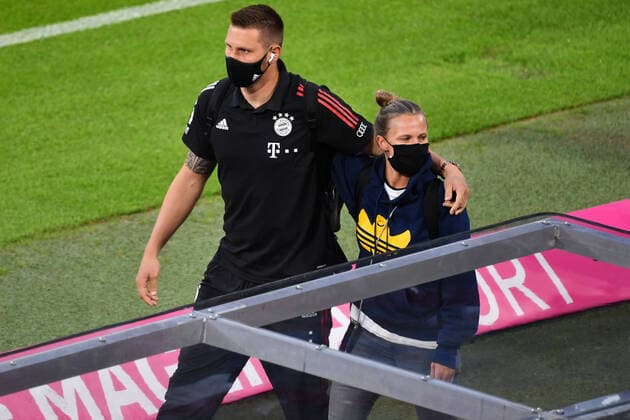 Niklas SUELE Bayern Muenchen and Kathleen KRUEGER team manager FCB on their arrival at the arena with mouthguard, mask football 1 Bundesliga season 2020 2021,1 match day,match day01, FC Bayern Muenchen M FCSchalke 04 GE 8 0, on 18 09 2020 in Munich A L L I A N Z A R E N A, DFL REGULATIONS PROHIBIT ANY USE OF PHOTOGRAPHS AS IMAGE SEQUENCES AND OR QUASI VIDEO EDITORIAL USE ONLY
