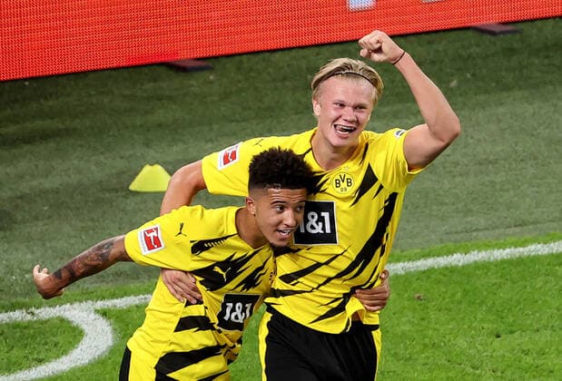 (200920) -- DORTMUND, Sept. 20, 2020 -- Erling Haaland (R) of Dortmund celebrates scoring with his teammate Jadon Sancho during a German Bundesliga match between Borussia Dortmund and Borussia Moenchengladbach in Dortmund, Germany, Sept. 19, 2020. (Photo by Xinhua) (SP)GERMANY-DORTMUND-FOOTBALL-BUNDESLIGA-DORTMUND VS MOENCHENGLADBACH JoachimxBywaletz 