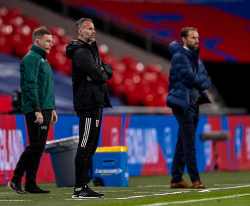(201009) -- LONDON, Oct. 9, 2020 () -- Wales head coach Ryan Giggs (C) and England s head coach Gareth Southgate are seen during a friendly match between England and Wales in London, Britain, on Oct. 8, 2020. () (SP) BRITAIN-LONDON-FOOTBALL-FRIENDLY MATCH-ENGLAND VS WALES Xinhua 