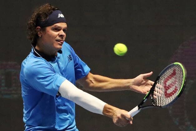 ST PETERSBURG, RUSSIA - OCTOBER 13, 2020: Canadian tennis player Milos Raonic struggles in a Round of 32 match against his American rival Jeffrey John Wolf during the St Petersburg Open 2020 international tournament held at Sibur Arena. Alexander Demianchuk TASS  TS0EAB1C