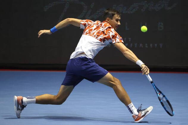 ST PETERSBURG, RUSSIA - OCTOBER 14, 2020: Russia s Evgeny Donskoy competes in a Round of 32 match against Switzerland s Wawrinka at the St Petersburg Open 2020 international tournament at Sibur Arena. Alexander Demianchuk TASS  TS0EAD56