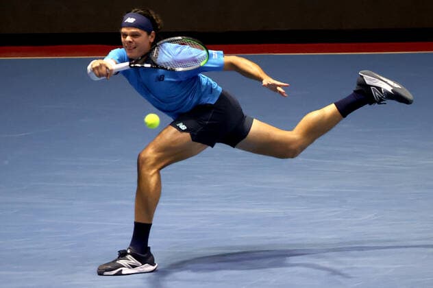 ST PETERSBURG, RUSSIA - OCTOBER 17, 2020: Canada s Milos Raonic returns the ball in a semifinal match against Croatia s Borna Coric at the St Petersburg Open 2020 international tournament held at Sibur Arena. Alexander Demianchuk TASS  TS0EB34E