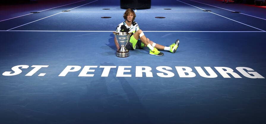 ST PETERSBURG, RUSSIA - OCTOBER 18, 2020: Russia s tennis player Andrei Rublev celebrates with the trophy after winning the final match against Croatia s Coric at the 2020 St Petersburg Open International Tournament at Sibur Arena. Andrei Rublev won the match 6-4, 7-6. Alexander Demianchuk TASS  TS0EB4AB