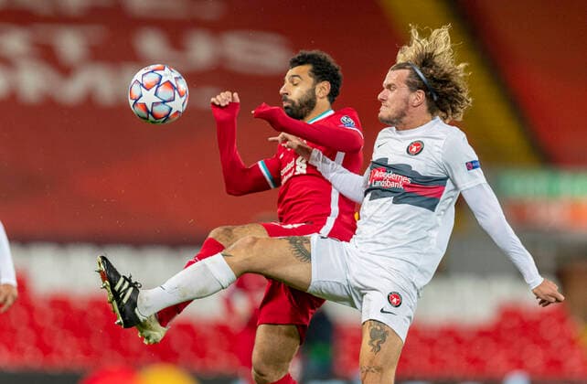 (201028) -- LIVERPOOL, Oct. 28, 2020 -- Liverpool s Mohamed Salah (L) vies with FC Midtjylland s Alexander Scholz during the UEFA Champions League match between Liverpool FC and FC Midtjylland at Anfield in Liverpool, Britain, on Oct. 27, 2020. FOR EDITORIAL USE ONLY. NOT FOR SALE FOR MARKETING OR ADVERTISING CAMPAIGNS. NO USE WITH UNAUTHORIZED AUDIO, VIDEO, DATA, FIXTURE LISTS, CLUB LEAGUE LOGOS OR LIVE SERVICES. SUN OUT. ONLINE IN-MATCH USE LIMITED TO 45 IMAGES, NO VIDEO EMULATION. NO USE IN BETTING, GAMES OR SINGLE CLUB LEAGUE PLAYER PUBLICATIONS. (SP)BRITAIN-LIVERPOOL-FOOTBALL-UEFA CHAMPIONS LEAGUE-LIVERPOOL FC VS FC MIDTJYLLAND HanxYan