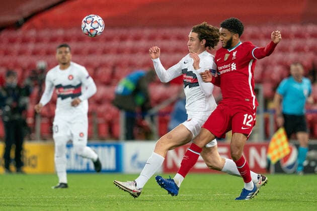 Football - 2020 2021 Champions League - Group D - Liverpool vs FC Midtjylland - Anfield Midtjylland s BOZHIDAR KRAEV battles with Liverpool s Joe Gomez COLORSPORT TERRY DONNELLY 