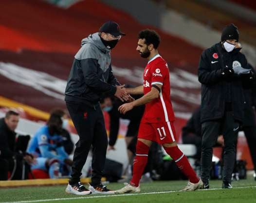 Jurgen Klopp manager of Liverpool greets Mohamed Salah of Liverpool during the Premier League match at Anfield, Liverpool. Picture date: 31st October 2020. Picture credit should read: Darren Staples Sportimage EDITORIAL USE ONLY. No use with unauthorised audio, video, data, fixture lists, club league logos or live services. Online in-match use limited to 120 images, no video emulation. No use in betting, games or single club league player publications. SPI-0737-0050