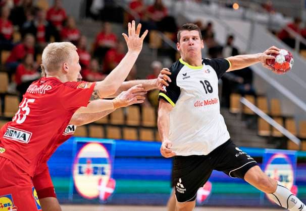 Switzerlands Dimitrij Küttel against Denmarks Henrik Moellgaard in the European Championship qualifier in mens handball between Denmark and Switzerland in Ceres Arena in Aarhus, Thursday 5 November 2020, Aalborg Jylland Denmark  Copyright: HenningxBagger HenningxBaggerx COP106 spdk20201105-214600-L