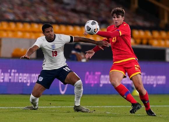 Rhian Brewster of England tackled by Francisco Pomares of Andorra during the UEFA EURO, EM, Europameisterschaft,Fussball U21, U 21 Qualifying match at Molineux, Wolverhampton. Picture date: 13th November 2020. Picture credit should read: Andrew Yates Sportimage EDITORIAL USE ONLY. No use with unauthorised audio, video, data, fixture lists, club league logos or live services. Online in-match use limited to 120 images, no video emulation. No use in betting, games or single club league player publications. SPI-0753-0026