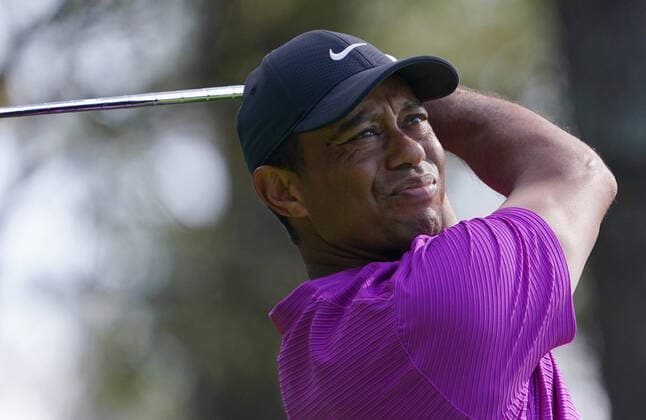 Tiger Woods watches his shot on the fourth hole during the third round of the 2020 Masters golf tournament at Augusta National Golf Club in Augusta, Georgia on Saturday, November 14, 2020.  AUG20201114318 KEVINxDIETSCH