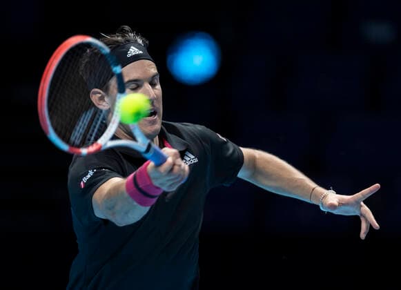 (201116) -- LONDON, Nov. 16, 2020 -- Dominic Thiem of Austria returns a shot during the singles group match against Stefanos Tsitsipas of Greece at the ATP, Tennis Herren World Tour Finals 2020 in London, Britain, on Nov. 15, 2020. ) (SP) BRITAIN-LONDON-TENNIS-ATP FINAL-DAY 1 HanxYan 