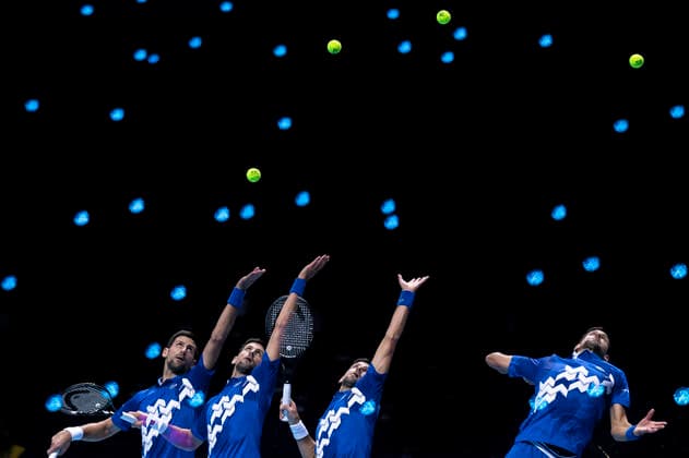 (201117) -- LONDON, Nov. 17, 2020 -- The multiple exposure photo shows Novak Djokovic of Serbia serving during the singles group match against Diego Schwartzman of Argentina at the ATP, Tennis Herren World Tour Finals 2020 in London, Britain, on Nov. 16, 2020. ) (SP)BRITAIN-LONDON-TENNIS-ATP FINALS-DAY 2 HanxYan 