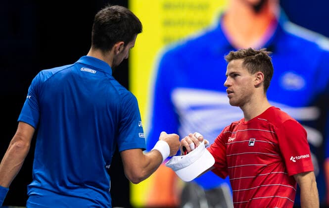 (201117) -- LONDON, Nov. 17, 2020 -- Novak Djokovic of Serbia (L) greets with Diego Schwartzman of Argentina after the singles group match against Diego Schwartzman of Argentina at the ATP, Tennis Herren World Tour Finals 2020 in London, Britain, on Nov. 16, 2020. ) (SP)BRITAIN-LONDON-TENNIS-ATP FINALS-DAY 2 HanxYan 
