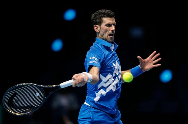 (201119) -- LONDON, Nov. 19, 2020 -- Novak Djokovic of Serbia hits a return during the singles group match against Daniil Medvedev of Russia at the ATP, Tennis Herren World Tour Finals 2020 in London, Britain, on Nov. 18, 2020. ) (SP)BRITAIN-LONDON-TENNIS-ATP FINALS-DAY 4 HanxYan 