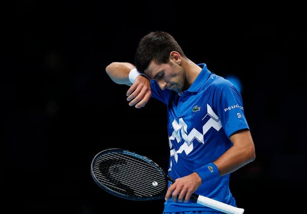 (201119) -- LONDON, Nov. 19, 2020 -- Novak Djokovic of Serbia looks dejected during the singles group match against Daniil Medvedev of Russia at the ATP, Tennis Herren World Tour Finals 2020 in London, Britain, on Nov. 18, 2020. ) (SP)BRITAIN-LONDON-TENNIS-ATP FINALS-DAY 4 HanxYan 