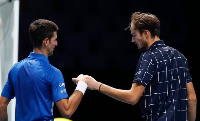 (201119) -- LONDON, Nov. 19, 2020 -- Daniil Medvedev (R) of Russia greets with Novak Djokovic of Serbia after their singles group match at the ATP, Tennis Herren World Tour Finals 2020 in London, Britain, on Nov. 18, 2020. ) (SP)BRITAIN-LONDON-TENNIS-ATP FINALS-DAY 4 HanxYan 
