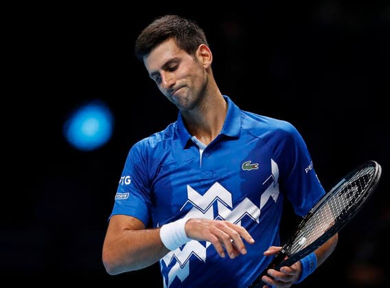 (201119) -- LONDON, Nov. 19, 2020 -- Novak Djokovic of Serbia looks dejected during the singles group match against Daniil Medvedev of Russia at the ATP, Tennis Herren World Tour Finals 2020 in London, Britain, on Nov. 18, 2020. ) (SP)BRITAIN-LONDON-TENNIS-ATP FINALS-DAY 4 HanxYan 