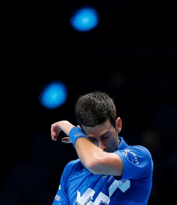 (201119) -- LONDON, Nov. 19, 2020 -- Novak Djokovic of Serbia looks dejected during the singles group match against Daniil Medvedev of Russia at the ATP, Tennis Herren World Tour Finals 2020 in London, Britain, on Nov. 18, 2020. ) (SP)BRITAIN-LONDON-TENNIS-ATP FINALS-DAY 4 HanxYan 