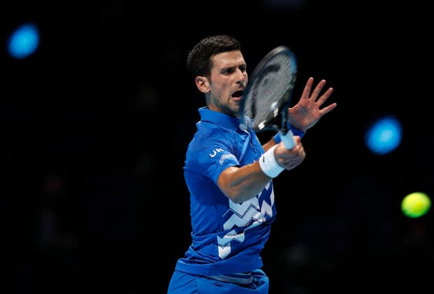 (201119) -- LONDON, Nov. 19, 2020 -- Novak Djokovic of Serbia hits a return during the singles group match against Daniil Medvedev of Russia at the ATP, Tennis Herren World Tour Finals 2020 in London, Britain, on Nov. 18, 2020. ) (SP)BRITAIN-LONDON-TENNIS-ATP FINALS-DAY 4 HanxYan 