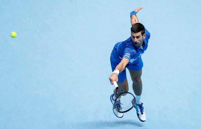 (201122) -- LONDON, Nov. 22, 2020 -- Novak Djokovic of Serbia hits a return during the singles group semifinal against Dominic Thiem of Austria at the ATP, Tennis Herren World Tour Finals 2020 in London, Britain, Nov. 21, 2020. ) (SP)BRITAIN-LONDON-TENNIS-ATP FINALS-SEMIFINAL HanxYan 