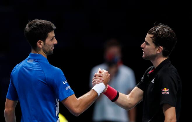 (201122) -- LONDON, Nov. 22, 2020 -- Dominic Thiem (R) of Austria greets Novak Djokovic of Serbia after their the singles group semifinal at the ATP, Tennis Herren World Tour Finals 2020 in London, Britain, Nov. 21, 2020. ) (SP)BRITAIN-LONDON-TENNIS-ATP FINALS-SEMIFINAL HanxYan 