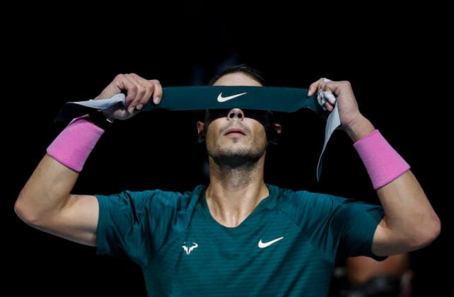 (201122) -- LONDON, Nov. 22, 2020 -- Rafael Nadal of Spain puts on his hairband during the singles semifinal against Daniil Medvedev of Russia at the ATP, Tennis Herren World Tour Finals 2020 in London, Britain, on Nov. 21, 2020. ) (SP)BRITAIN-LONDON-TENNIS-ATP FINALS-SEMIFINAL HanxYan 