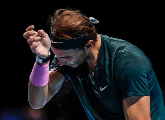 (201122) -- LONDON, Nov. 22, 2020 -- Rafael Nadal of Spain wipes his face during the singles semifinal against Daniil Medvedev of Russia at the ATP, Tennis Herren World Tour Finals 2020 in London, Britain, on Nov. 21, 2020. ) (SP)BRITAIN-LONDON-TENNIS-ATP FINALS-SEMIFINAL HanxYan 
