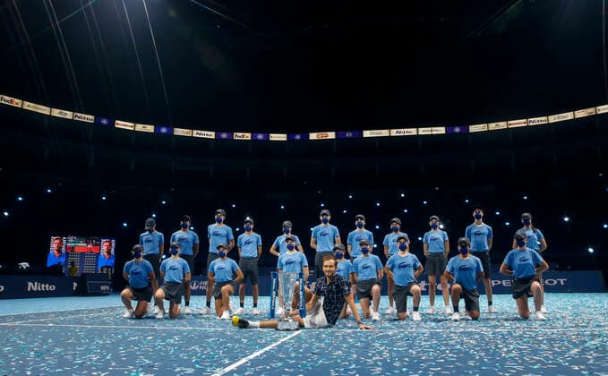 (201123) -- LONDON, Nov. 23, 2020 -- Daniil Medvedev (front) of Russia poses with ball kids and his trophy during the awarding ceremony for the singles final against Dominic Thiem of Austria at the ATP, Tennis Herren World Tour Finals 2020 in London, Britain, Nov. 22, 2020. ) (SP)BRITAIN-LONDON-TENNIS-ATP FINALS-FINAL HanxYan 
