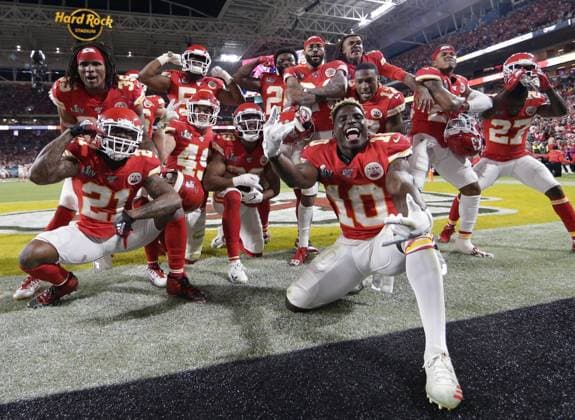 Kansas City Chiefs wide receiver Tyreek Hill (10) and the Chiefs defense celebrate in the fourth quarter against the San Francisco 49ers in Super Bowl LIV at the Hard Rock Stadium in Miami Gardens on Sunday, February 2, 2020. The Kansas City Chiefs defeated the San Francisco 49ers 31-20.  POY2020S069 JOHNxANGELILLO